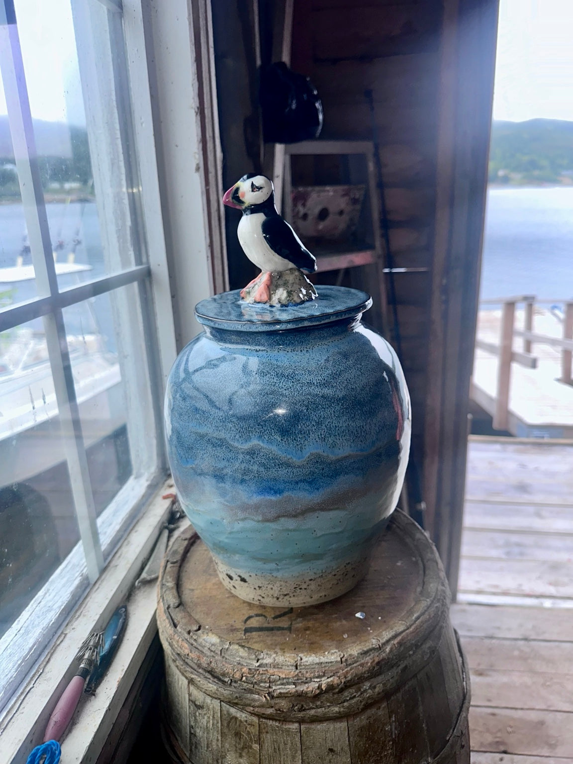 The Cove Sentinel handmade blue-green stoneware puffin lidded jar by Hatchet Cove Pottery