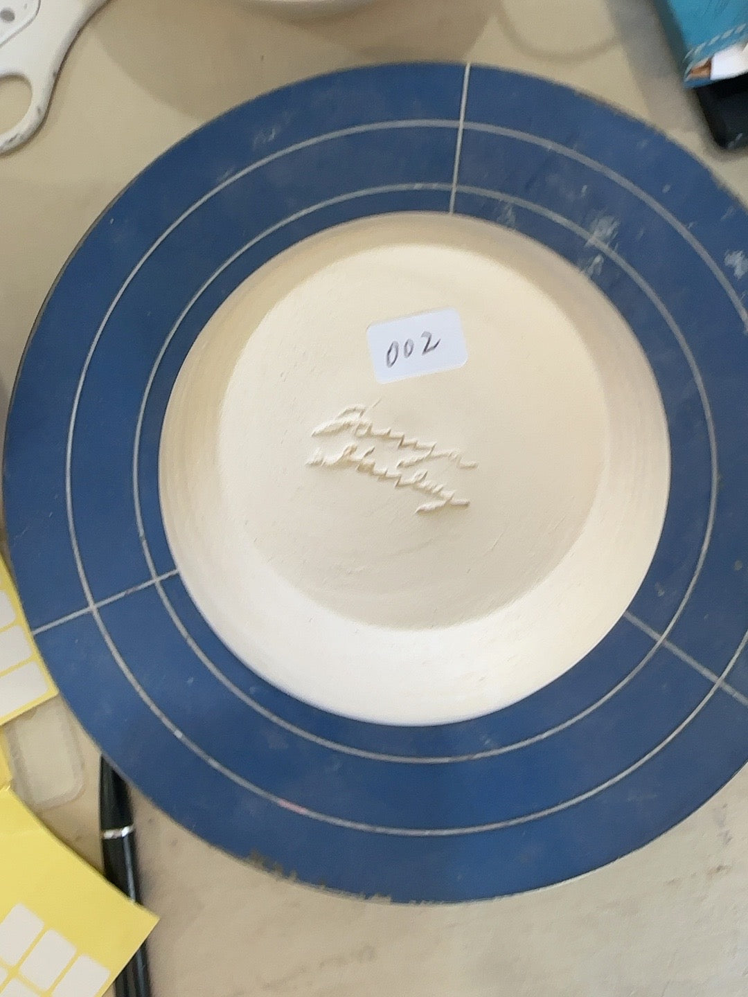 Studio Piece 002 bisque bowl base and maker mark