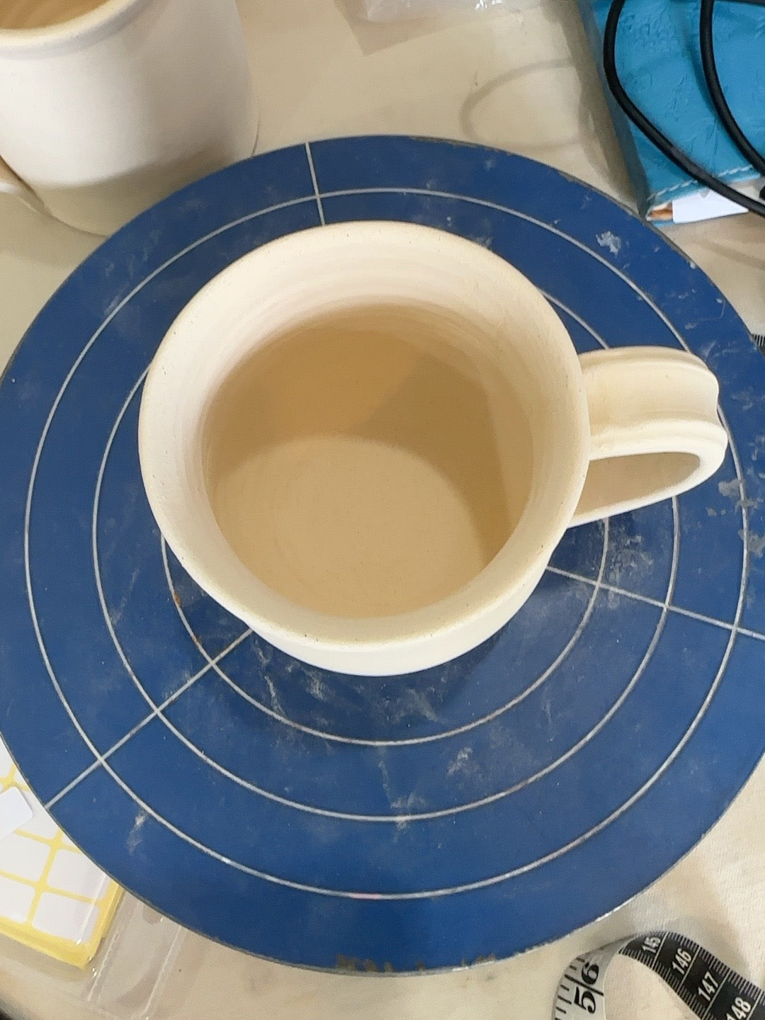 Studio Piece 022 bisque mug rim and interior