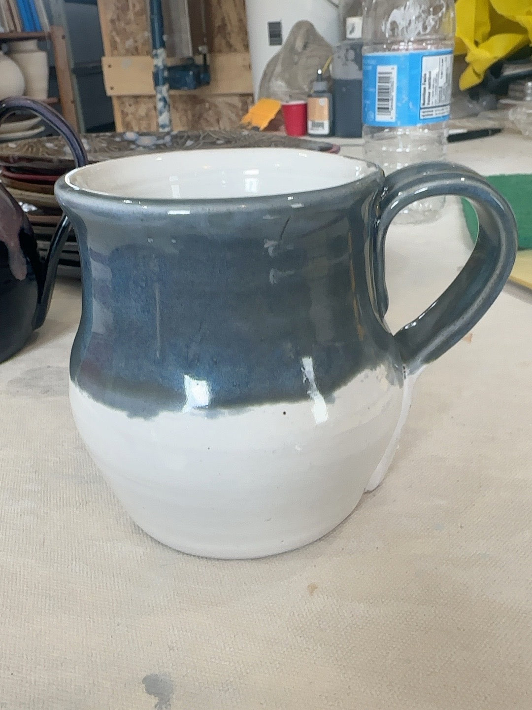 HCP-085 handmade stoneware mug with white lower body and blue-grey upper glaze